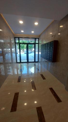 a large room with a lobby with a large glass door at ARIA Residence & Ѕра, Apartment 1-43, level 8 in Bitola