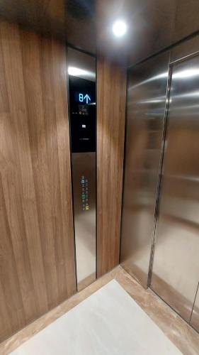 a elevator in a building with a clock on it at ARIA Residence & Ѕра, Apartment 1-43, level 8 in Bitola