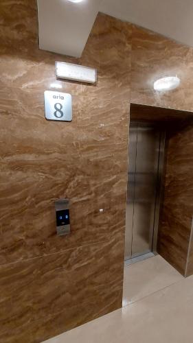an elevator in a building with a sign on the wall at ARIA Residence & Ѕра, Apartment 1-43, level 8 in Bitola