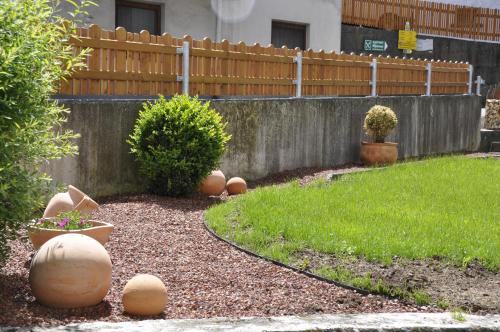 a garden with a wooden fence and some plants at Flierelerhof in Arzl im Pitztal