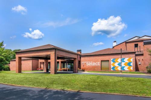a building with a mural on the side of it at Sonesta Select Boston Foxborough Mansfield in Foxborough