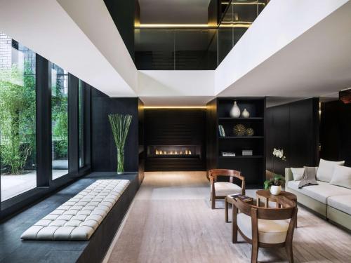 a living room with a couch and a table at The Temple House in Chengdu