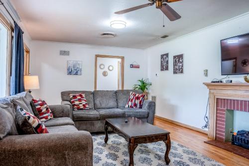 a living room with a couch and a fireplace at Spacious 4 Bedroom Home with 5 Beds near Interstate 40 in Amarillo, TX in Amarillo