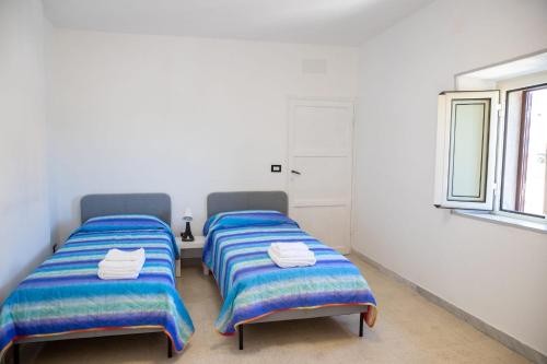 מיטה או מיטות בחדר ב-Casa Simone Campagnano di Roma