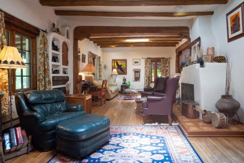 a living room with a couch and a chair at Inn on La Loma Plaza in Taos