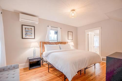 a bedroom with a large white bed and a window at Patty's Place in Coeur d'Alene