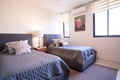 Giường trong phòng chung tại Best Location Americana @serra