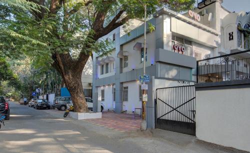 a building on the side of a street at Hotel Sunshine Near Inox in Pune