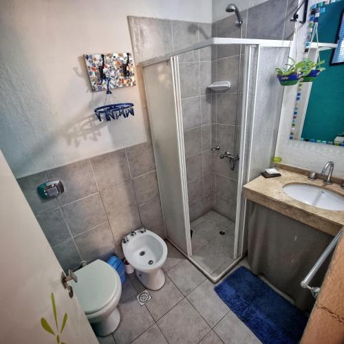 a bathroom with a shower and a toilet and a sink at Posada Villapancha B&B in San Javier