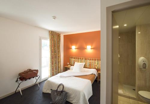 Cama o camas de una habitación en Hôtel Esplanade Eden