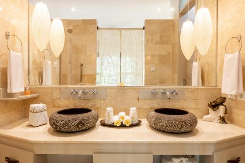 a bathroom with two sinks and a large mirror at PROMO! Luxury Villa Escape in Ubud 2 BR in Ubud