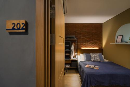 Cama o camas de una habitación en Cove W Suites
