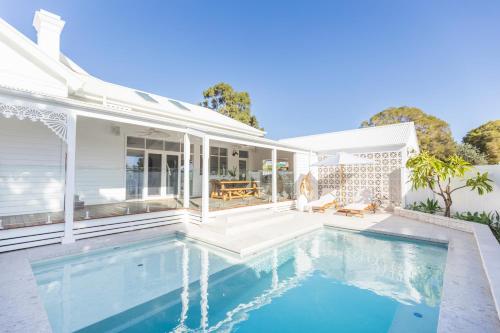 a swimming pool in the backyard of a house at White House Swan Hill in Swan Hill