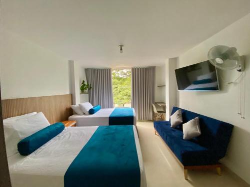 Postel nebo postele na pokoji v ubytování San Ignacio Hotel