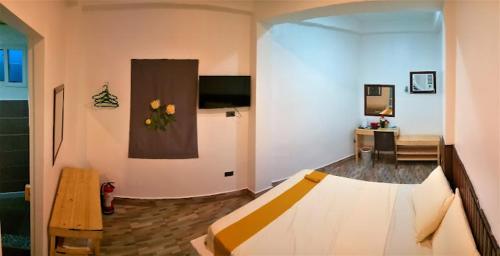 a room with a bed and a living room at BBoutique Hotel in Lapu Lapu City