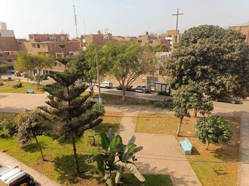 a view of a park with a christmas tree at Pretty room in front of the Lima Airport in Lima