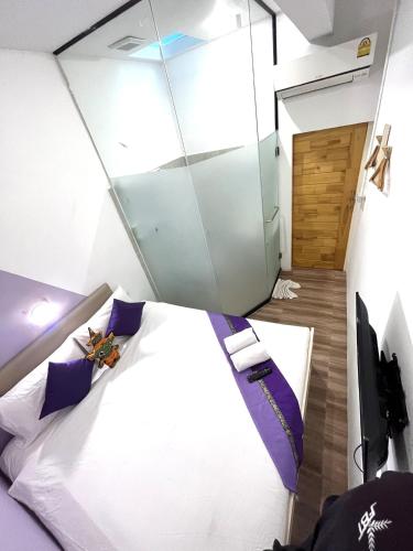 Ένα ή περισσότερα κρεβάτια σε δωμάτιο στο Hanuman VIP Hostel