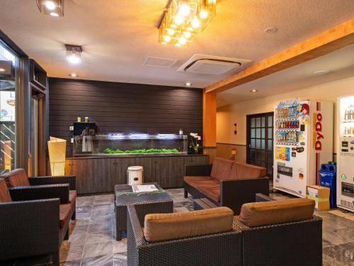 a lobby of a restaurant with a fish tank at SUIHOUEN in Numazu