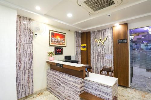 an office with a reception desk in a room at FabHotel Aman Sara in Lucknow
