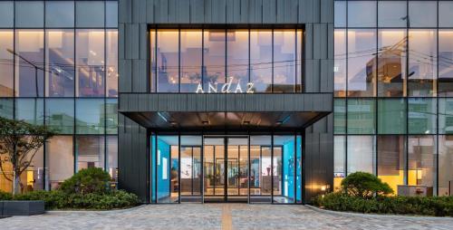 an office building with anova sign on the facade at Andaz Seoul Gangnam in Seoul