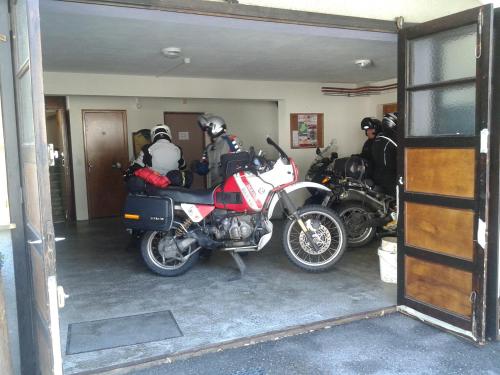 a group of motorcycles parked in a garage at Hôtel Flor'Alpes in La Giettaz