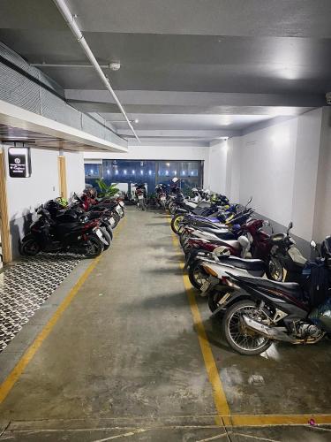 a row of motorcycles parked in a parking garage at Sky Hotel & Homestay Ha Giang in Ha Giang