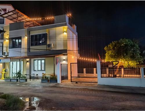 a house with lights on top of it at night at ChanthaSouk Vang Vieng Entire Villa in Vang Vieng