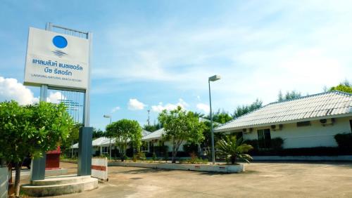 a sign for a hospital in front of a building at Laemsing Natural Beach Resort in Ban Pak Nam
