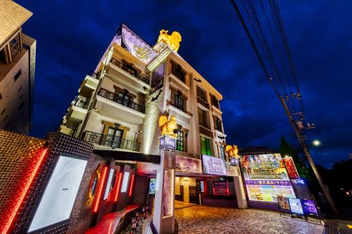 a building with signs on the side of it at Hotel Luna Machida -Adult Only in Machida