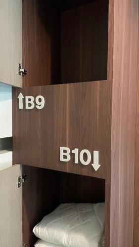 a cupboard with a bko sign on it at Comfort Zone Hostel @ Tha Pae in Chiang Mai