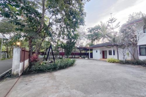an empty parking lot in front of a house at Bann White Chalet Khaoyai in Mu Si