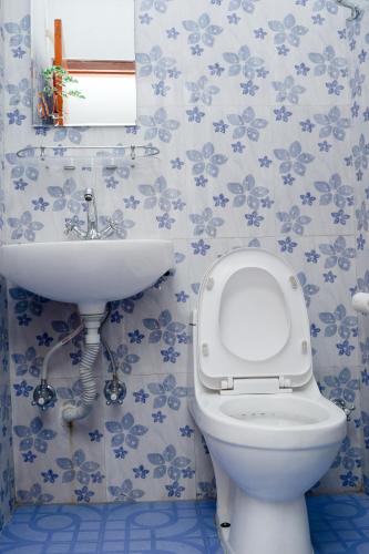 a bathroom with a toilet and a sink at Hotel Admire Pokhara Pvt. Ltd. in Pokhara