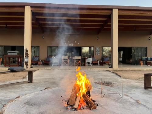 a fire pit in the middle of a building at Mananga Bush Villa in Skukuza