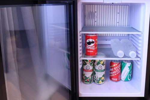 a refrigerator filled with food and drinks at Hotel PJ Myeongdong in Seoul