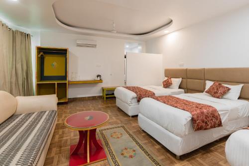 Postel nebo postele na pokoji v ubytování Hotel Ratnasambhava