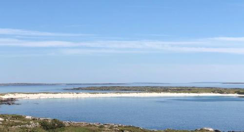 an island in the middle of a body of water at Bruíon Connemara in Cleggan