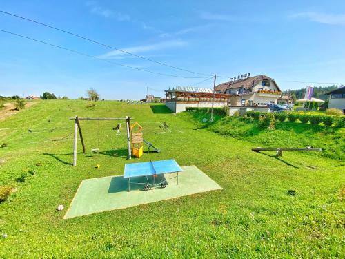 an aerial view of a playground in a field at 16 Lakes Hotel in Grabovac