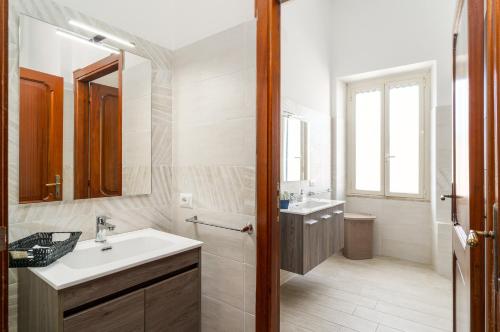 a bathroom with a sink and a mirror at Casa Rachele in Dorgali