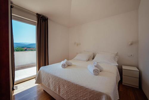 Postel nebo postele na pokoji v ubytování Villa Latica