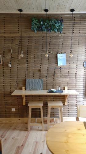a dining room with a table and two chairs at Casinhas de S. Francisco T2 Azeitona by LovelyStay in Freixo de Espada à Cinta