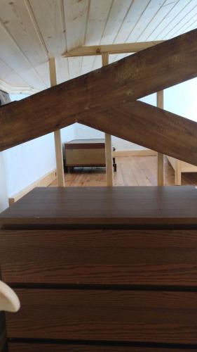 a close up of a wooden bed in a room at Casinhas de S. Francisco T2 Azeitona by LovelyStay in Freixo de Espada à Cinta