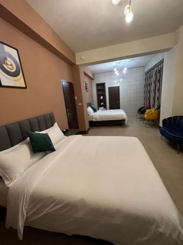 Ένα ή περισσότερα κρεβάτια σε δωμάτιο στο Haoyue Hotel
