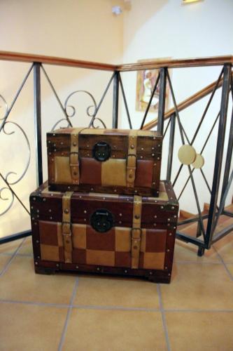 two suitcases stacked on top of each other at Kira's Boutique Hotel in Mindelo