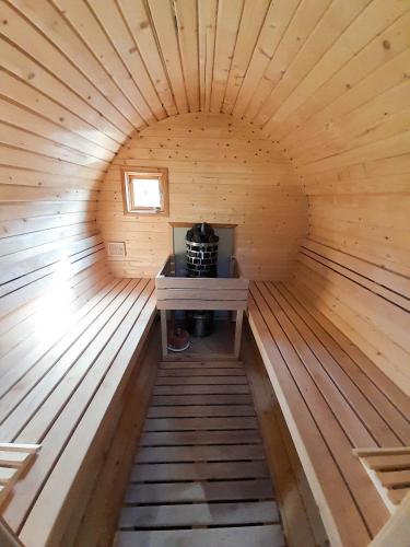 a inside of a sauna with a stove in it at Słodki Zakątek Spa Jacuzzi&Sauna in Sobolów
