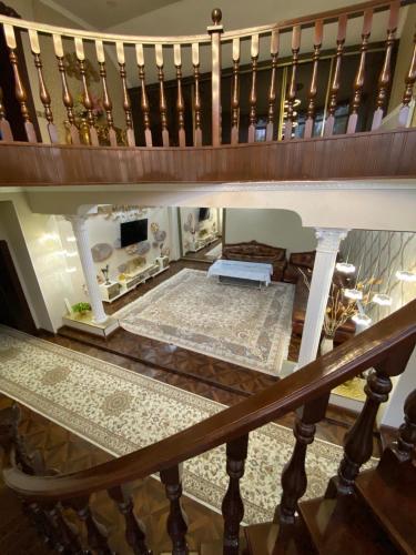 a view of a living room from under a stairs at Sultan Saray in Osh