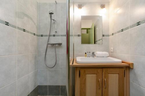 a bathroom with a sink and a shower at Chamonix Sud - Jonquilles 38 - Happy Rentals in Chamonix-Mont-Blanc