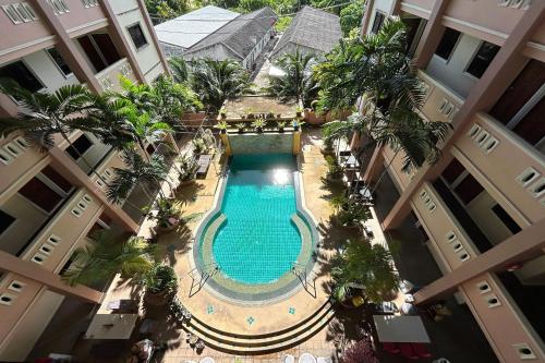 an overhead view of a swimming pool in a building at SB Park Mansion in Phuket