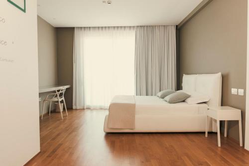Postel nebo postele na pokoji v ubytování Copacabana Hotel Design