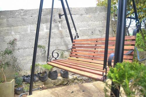 a swing on a swing set in a garden at Mount Elegance in Nuwara Eliya