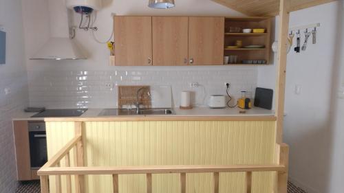 a small kitchen with a counter and a sink at Casinhas de S. Francisco T1 Amêndoa by LovelyStay in Freixo de Espada à Cinta